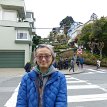 P025 at southeast corner of Leavenworth & Lombard, take a look at what's behind me - the famous crooked street featuring 8 hairpin turns, and the nice beautiful...
